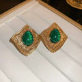 Emerald frame stud earrings
