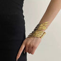 Gold abstract ripple bangle